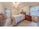 Comfortable bedroom featuring carpeted floors, a queen bed, and natural light at 4840 Autumn Leaf Ln, Charlotte, NC 28277