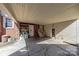 Spacious carport area with storage shelving, offering convenience and protection from the elements at 4840 Autumn Leaf Ln, Charlotte, NC 28277