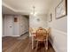 Bright dining room with wood-look flooring and a traditional chandelier at 4840 Autumn Leaf Ln, Charlotte, NC 28277