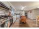 View of the kitchen with stainless steel appliances, an island, and access to the dining room at 4840 Autumn Leaf Ln, Charlotte, NC 28277