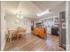 Eat-in kitchen featuring an island, stainless steel appliances, and wood-look flooring at 4840 Autumn Leaf Ln, Charlotte, NC 28277