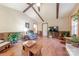 Inviting living room with paneled walls and a view into the kitchen at 4840 Autumn Leaf Ln, Charlotte, NC 28277