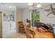 Cozy dining area with wood table, window, and convenient laundry area featuring washer and dryer at 5128 Green Leaf Ct, Mount Holly, NC 28120