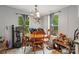 Comfortable dining area with wooden table, chairs, and natural lighting from windows at 5128 Green Leaf Ct, Mount Holly, NC 28120