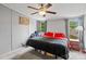 Bright main bedroom with ceiling fan and natural light from the two windows at 5128 Green Leaf Ct, Mount Holly, NC 28120