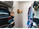 Walk-in closet with shelving and rod space for clothing storage at 529 N Graham St # 2G, Charlotte, NC 28202