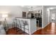 Modern kitchen with stainless steel appliances, bar seating, and dark countertops at 529 N Graham St # 2G, Charlotte, NC 28202