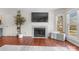 Cozy living room featuring a fireplace, built-in shelving, and bright window view at 529 N Graham St # 2G, Charlotte, NC 28202