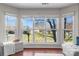Large windows offering plenty of natural light and views of the outdoor trees and landscape at 529 N Graham St # 2G, Charlotte, NC 28202