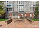 Outdoor stone fire pit and seating area surrounded by well-maintained landscaping at 529 N Graham St # 2G, Charlotte, NC 28202