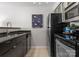 Well-equipped kitchen featuring modern appliances and sleek black countertops at 529 N Graham St, Charlotte, NC 28202