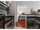 View of a modern kitchen featuring stainless steel appliances and sleek countertops at 529 N Graham St, Charlotte, NC 28202