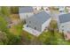 Aerial view of a gray two-story home with a concrete patio, and a fenced-in backyard at 5306 Graypark Dr, Charlotte, NC 28269