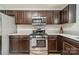 Close-up view of the kitchen features stainless steel appliances and dark cabinets at 5306 Graypark Dr, Charlotte, NC 28269