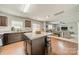 Bright kitchen showcases a center island with barstool seating, stainless steel appliances, and natural light at 5306 Graypark Dr, Charlotte, NC 28269