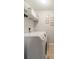 Well-lit laundry room featuring a side-by-side washer and dryer and ample shelving for storage at 5306 Graypark Dr, Charlotte, NC 28269