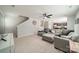 Living room view showcasing the open layout connecting to the kitchen and staircase at 5306 Graypark Dr, Charlotte, NC 28269