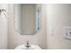 Small bathroom with a pedestal sink and mirror at 5532 Axil Ln, Charlotte, NC 28269