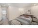 Cozy bedroom featuring a large bed, contemporary decor, and ample natural light at 5532 Axil Ln, Charlotte, NC 28269