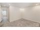 Well-lit carpeted bedroom with recessed lights and a neutral color palette at 5532 Axil Ln, Charlotte, NC 28269