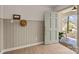 Bright entryway featuring wood floors, a painted door and wainscoting details at 6215 Coatbridge Ln, Charlotte, NC 28212