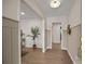 Hallway with wood floors and neutral walls and decor at 6215 Coatbridge Ln, Charlotte, NC 28212