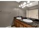 Double sink bathroom with granite counters and large mirror at 705 Tirzah Rd, York, SC 29745