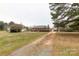 View of a brick single Gathering home with an attached two car garage and large front lawn at 705 Tirzah Rd, York, SC 29745