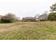 View of a brick single Gathering home with an attached two car garage and a large grass front lawn at 705 Tirzah Rd, York, SC 29745