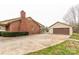 Side view of brick home and detached garage, showcasing ample parking and yard space at 705 Tirzah Rd, York, SC 29745