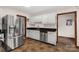 This spacious kitchen is equipped with stainless steel appliances and stylish white cabinets at 705 Tirzah Rd, York, SC 29745