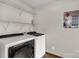 Functional laundry room with modern washer and dryer units at 705 Tirzah Rd, York, SC 29745