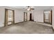 Bright and airy living room featuring neutral walls, carpet flooring, and natural light from windows at 705 Tirzah Rd, York, SC 29745