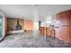 Spacious basement featuring stone floors, a stone fireplace, and a bar counter for entertaining at 7262 Right Angle St, Sherrills Ford, NC 28673