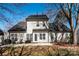 Back of home featuring a patio, manicured lawn and treelined yard at 7562 Sedgebrook W Dr, Stanley, NC 28164