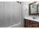 Bathroom with vanity, mirror, and shower with curtain at 7562 Sedgebrook W Dr, Stanley, NC 28164