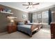 Cozy bedroom with ceiling fan, two twin beds, and natural light at 7562 Sedgebrook W Dr, Stanley, NC 28164