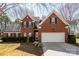 Charming two-story brick home with a two-car garage, manicured landscaping, and inviting curb appeal at 7562 Sedgebrook W Dr, Stanley, NC 28164