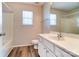 The full bathroom features a white vanity and a shower and tub at 8247 Pozzi Rd, Charlotte, NC 28216