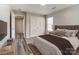 This bedroom features hardwood floors, neutral walls, closet, and a window for natural light at 8247 Pozzi Rd, Charlotte, NC 28216