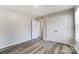 This light filled bedroom features a double door closet and wood floors at 8247 Pozzi Rd, Charlotte, NC 28216