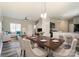 An open concept dining room and living room provides great flow at 8247 Pozzi Rd, Charlotte, NC 28216