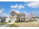 Charming two-story home with a well-manicured lawn and a one car garage at 8247 Pozzi Rd, Charlotte, NC 28216