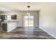 View of eat-in kitchen featuring hardwood floors and a sliding glass door to the back yard at 8247 Pozzi Rd, Charlotte, NC 28216