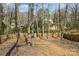 Spacious, fenced backyard surrounded by mature trees, offering privacy and a natural setting at 9613 Central Dr, Mint Hill, NC 28227