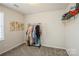 Minimalist bedroom with neutral tones, closet space, and ample lighting at 9613 Central Dr, Mint Hill, NC 28227