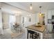 Bright and airy dining room with modern decor, a dining table, and stylish lighting at 9613 Central Dr, Mint Hill, NC 28227