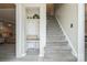 Welcoming entryway with storage hooks, bench, and staircase leading to upper level at 9613 Central Dr, Mint Hill, NC 28227