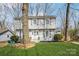 Inviting home featuring classic shutters, a charming front door, and well-maintained landscaping at 9613 Central Dr, Mint Hill, NC 28227