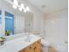 Well-lit bathroom featuring a vanity with drawers, a sink, toilet, and a shower/tub combination at 9684 Ravenscroft Nw Ln, Concord, NC 28027